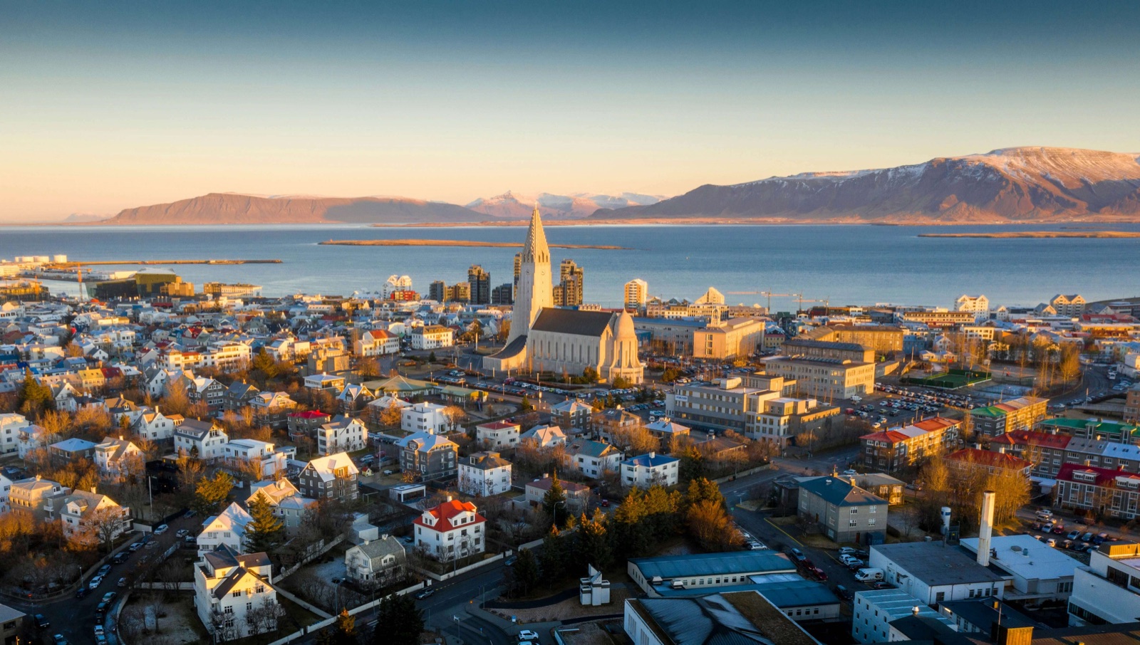 Reykjavík rooftops, Hallgrímskirkja and mountains beyond the harbour